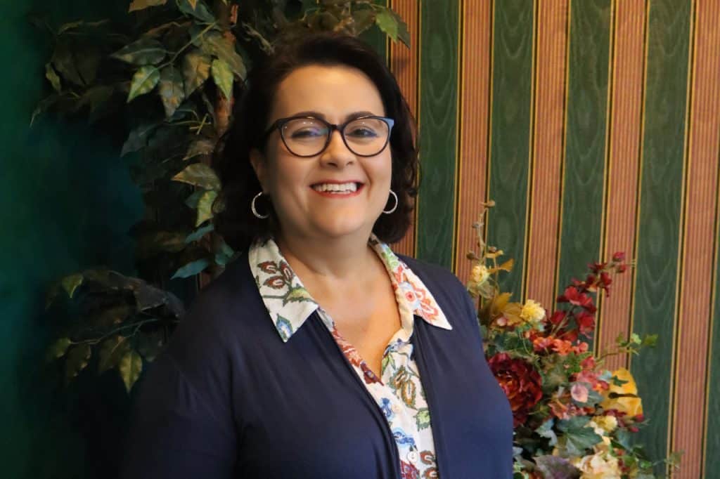 A receptionist smiling